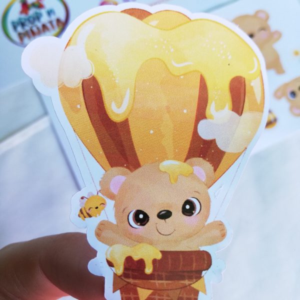 sticker of a Bear in a honey hot air balloon